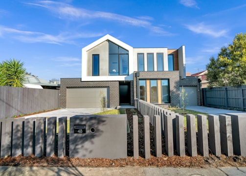 white and brown concrete building under blue sky during daytime