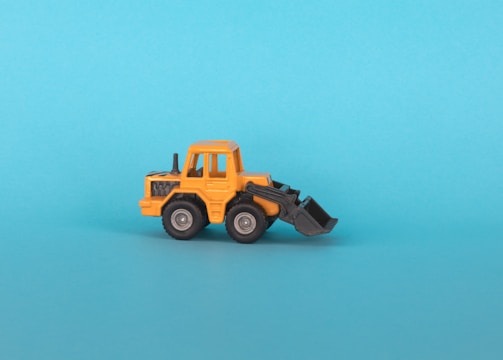 a toy truck on a blue background