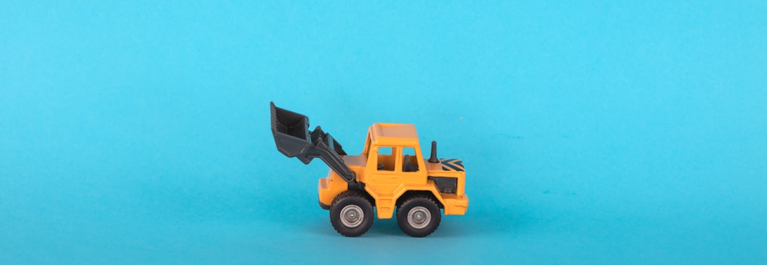 a toy truck on a blue background