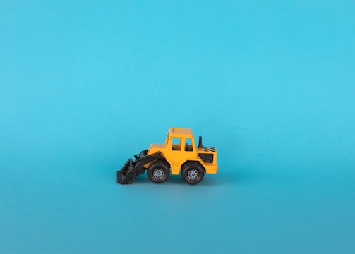 a toy truck on a blue background